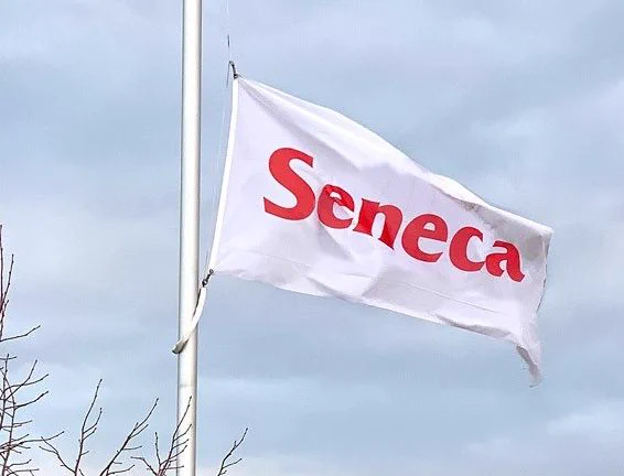 A Seneca flag being flown half-mast.