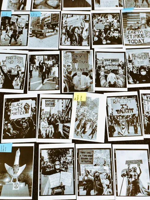 roughly laid A4 pages with black and white photographs on, each has a white border, all depict protests