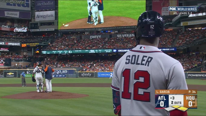 Jorge Soler looks out at the mound at Minute Maid Park as the Astros have a meeting on the mound before his at-bat during Game 6 of the 2021 World Series. Moments later he would hit a baseball that still hasn’t landed yet.