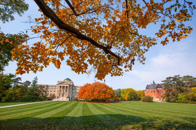 Beardshear Hall and Morrill Hall, framed by fall colors.