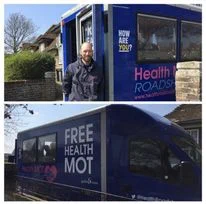 Man standing infront of the MOT Health Roadshow bus in Aylesham