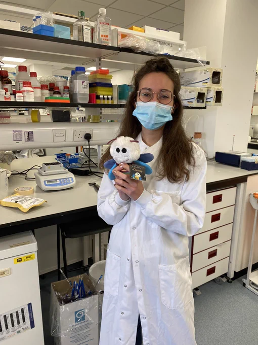 One of the winners of Promega ‘Where is Lumie’ competition with her price (a Lumie toy) in the lab.