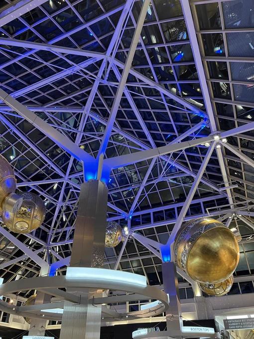 Interior Prudential Center atrium lit up in Perkins Blue