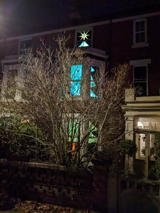A Christmas tree themed window display in Lincoln's West End