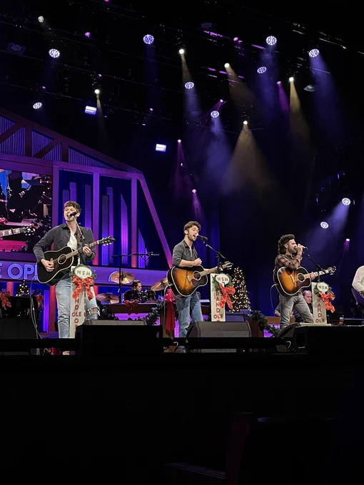 Restless Road on the Opry stage that is decorated with Christmas features