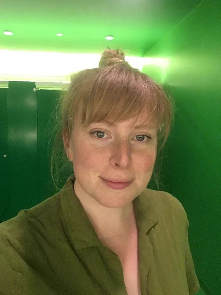 Portait image of Letty Clark, against a green background.
