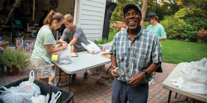 Photo of Kevin Beverly volunteering at a food bank