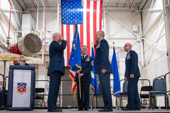 Brig. Gen. Gary McCue, director of the joint staff for the Ohio National Guard, salutes Col. Darren E. Hamilton, incoming commander, during the 179th Airlift Wing change of command ceremony at Mansfield Lahm ANGB, Ohio, Dec. 3, 2021. The passing of a unit’s guidon symbolizes a transfer of command. Col. Todd K. Thomas is retiring as Col. Darren E. Hamilton takes command. (U.S. Air National Guard photo by Master Sgt. Joe Harwood)