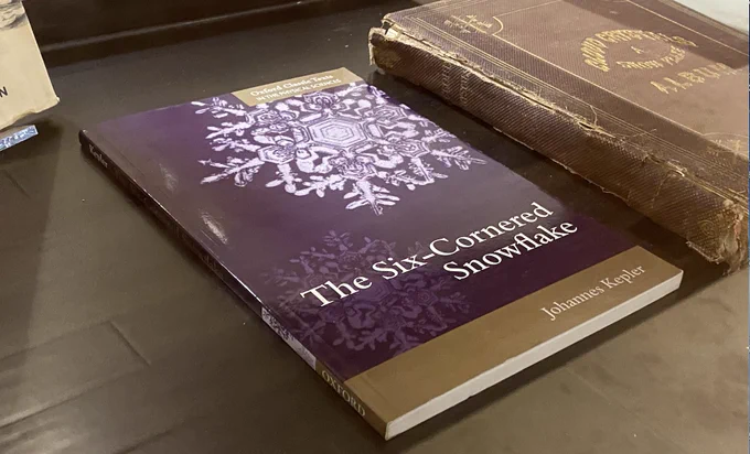 Photo of 2014 edition of Kepler's book on snowflakes, now on display in Holiday exhibit on 5th floor Bizzell Memorial Library