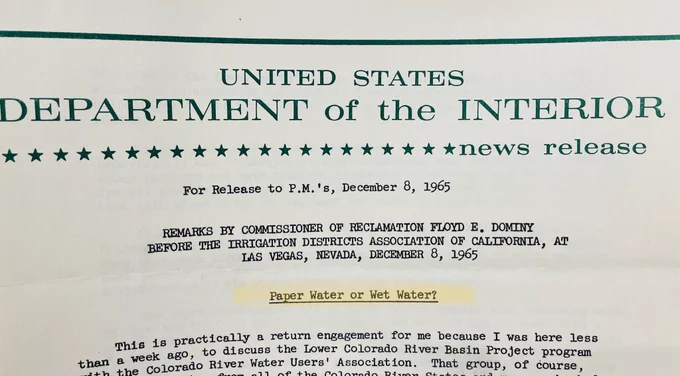 A news release from the United States Department of the interior that has a headline of “Paper water or wet water?” The news release concerns the Colorado River Basin project in 1965.