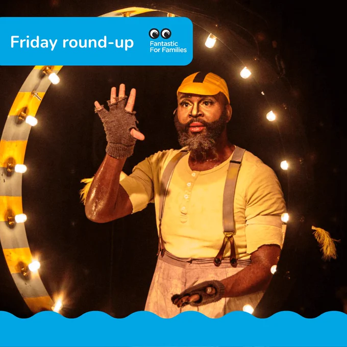 A black actor on a stage surrounded by a circle of lightbulbs.

