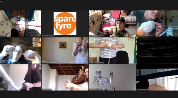 A screenshot shows an online Zoom meeting with 12 people in it, all interacting with pieces of string.  