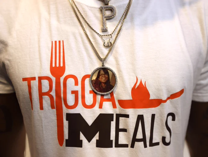 A close-up of Trigga Meals white t-shirt