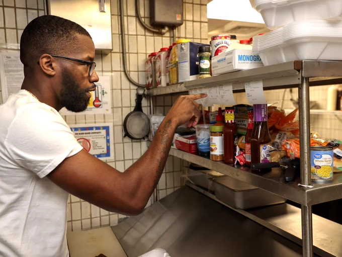Deante cooks in the Ziggys kitchen 