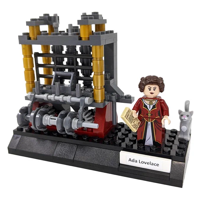 LEGO model of the Analytical Engine with a minifigure of Ada Lovelace as well as a small LEGO cat