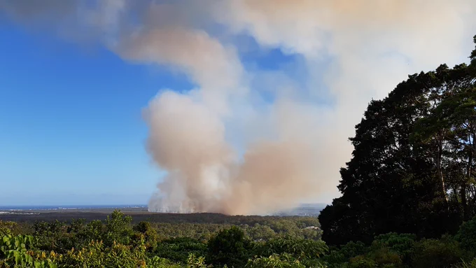 Bushfire in Mooloolah River National Park 14 December 2021. Seen from Buderim.