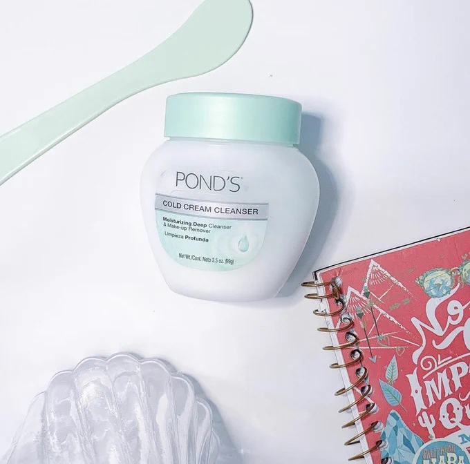 Cold cream cleanser and a notebook
