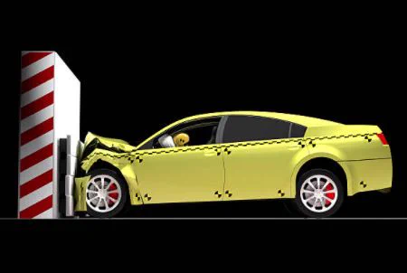 Car with crash dummy hitting wall