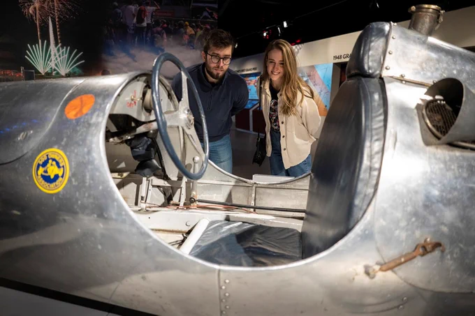 Racing car, with two visitors at Silverstone