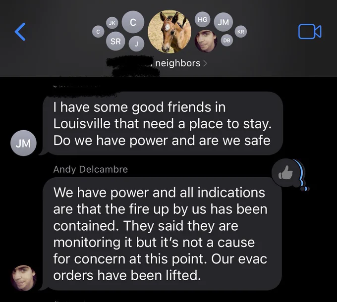 Screenshot of group text. Main message: Andy telling neighbors, “we have power and all indications are that the fire by us has been contained. They said they are monitoring it but it’s not a cause for concern at this point. Our evacuation orders have been lifted.”