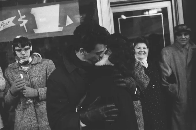A couple kisses to celebrate New Year's Eve at North State Street and West Randolph Street, Chicago, December 31, 1961. ST-15002870-0006, Chicago Sun-Times collection, CHM