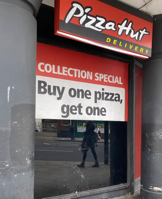 A Pizza Hut offer that has been cut off so it says “Buy one pizza, get one”