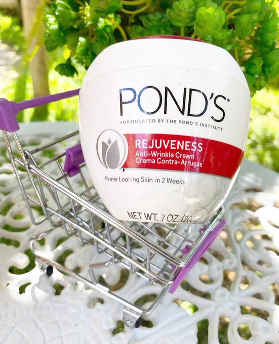 Jar of ponds in a toy shopping cart