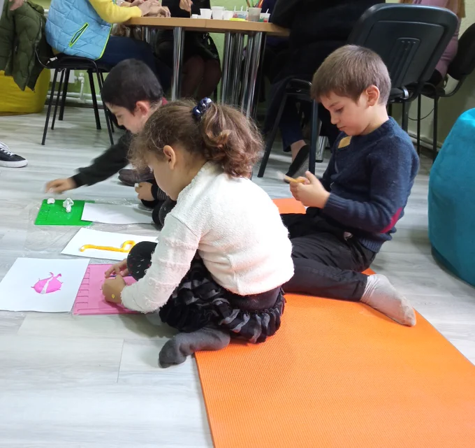 A group of displaced children from NK benefit from art therapy classes provided by Children's Support Centre in Kapan.