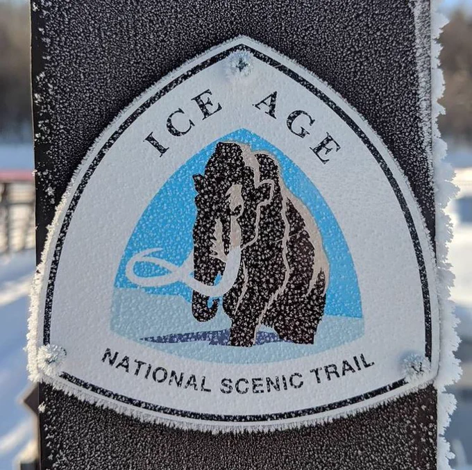 A frosty sign that reads “Ice Age National Scenic Trail.” Photo courtesy of Ice Age Trail Alliance.