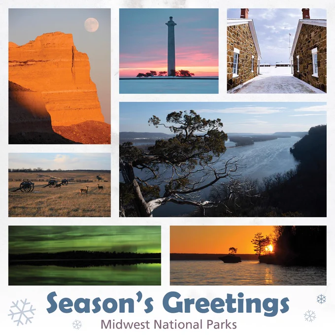 Photo collage of seven images from left to right, top to bottom. Image one: a steep rocky bluff colored orange during sunset. A full moon sits in a light blue sky above the cliff face. Image two: A cylindrical tower with a lake in front and sky behind. The sky is tinged with blue and pink and blue hues from the setting sun. Image three: View to a parade ground covered in snow between two one-story brick buildings. Image four: Three cannons sit on a field with rolling fields behind and two deer to the right. Image five: View of a wide river and bluffs from the top of a bluff. In the foreground,  a tree's gnarled branches stretch out toward the river. Image six: View of silhouetted trees with sky and lake shimmering green in the foreground at night. Image seven: An island with a single tree next to a larger island under an orange sky. The setting sun peeks through the branches of a tree on the larger island. Text at the bottom reads, "Season's Greetings. Midwest National Parks." 