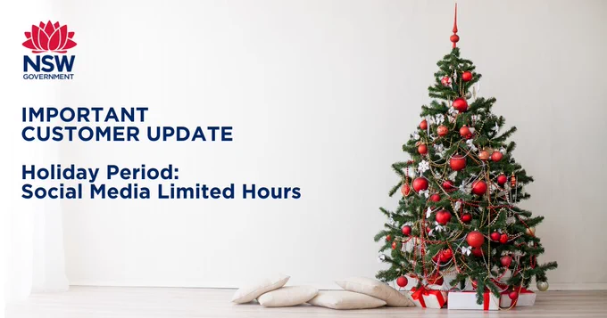 Green Christmas tree with red decorations and white presents underneath against white wall with text overlay 'Important Customer Update', 'Holiday Period: Social Media Limited Hours.'