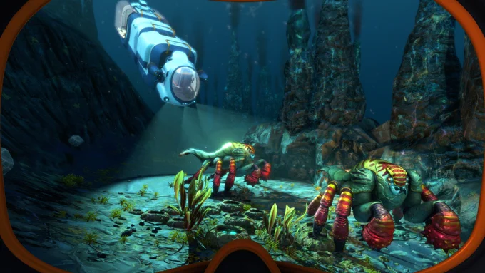 Screenshot from Subnautica: Below Zero. An undersea vehicle shines lights on some colorful lobster-like alien creatures. Tall thermal vents spires are in the background.