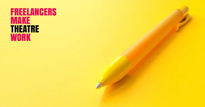 A yellow ball point pen sits on a plain yellow background with the red and black Freelancers Make Theatre Work logo above it.