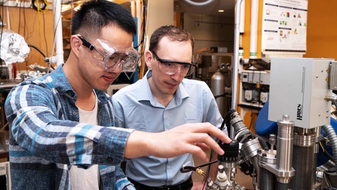 Student works with professor in lab at CMU