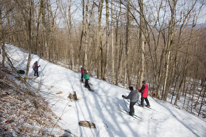 A group of people cross-country skiing by Ryan Hagerty/USFWS.