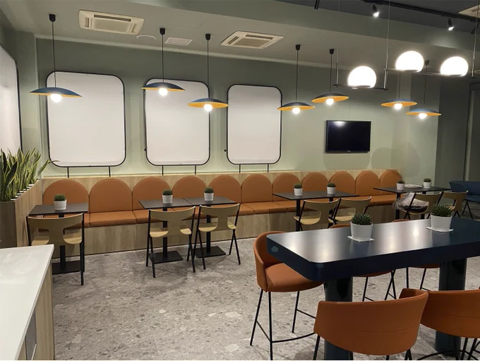 A different wide view of the redesigned Microsoft Athens cafeteria. Showcasing the sitting area.  