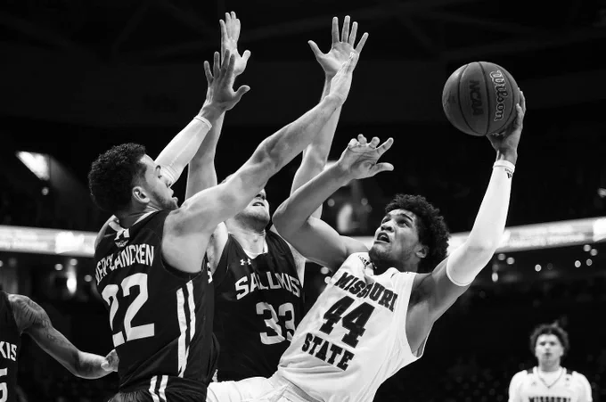 Gaige Prim puts up a shot against two defenders