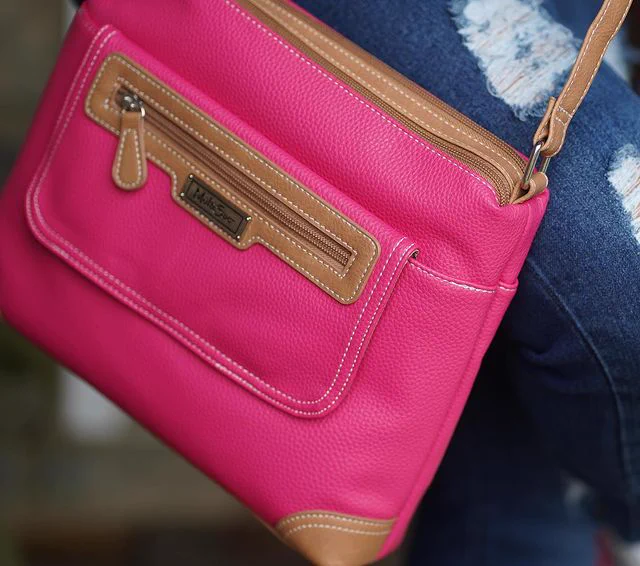 @madukessharon rocking her Fruit Punch Large Laredo Crossbody Bag with a jean button down shirt and ripped jean pants. 