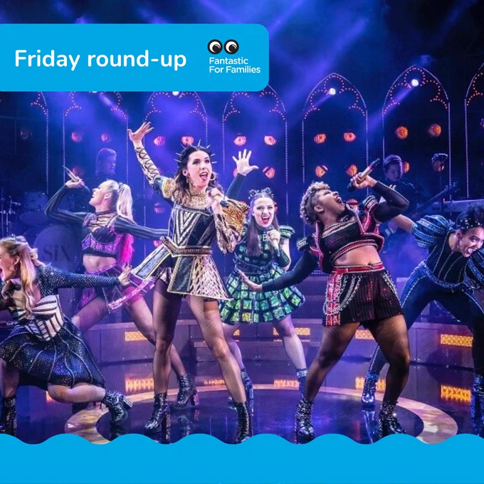 Six women of various ethnicities singing on a stage, dressed up in a girl-power band style
