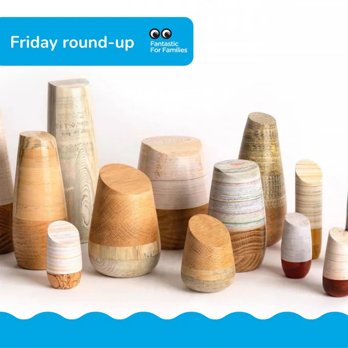 Glossy wooden shapes made from various kinds of wood in layers. They look like vases without holes.