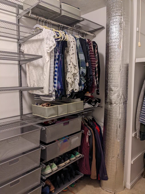 Closet after. 2 hanging rods. Multiple drawers and shelves. Organized.