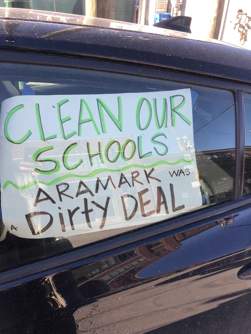 CTU Caravan protest sign, “clean our schools. Aramark was a dirty deal”.