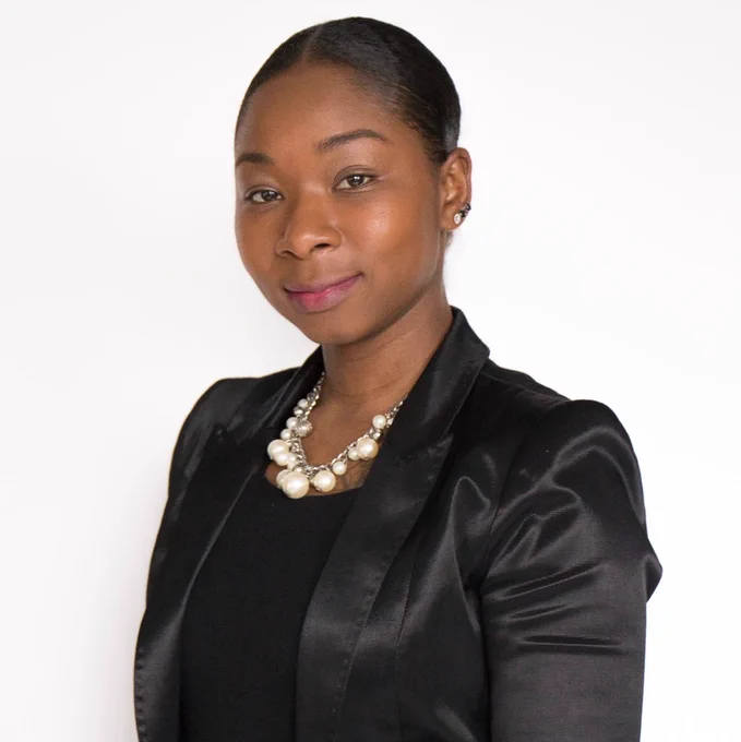 LaQuanda McCullough poses in front of a white background. 