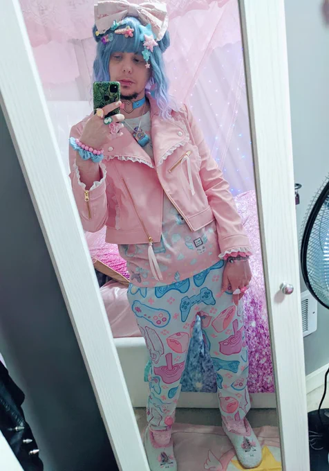 A photo of androidpriest in a pink and blue themed fairy kei outfit with a short blue/purple wig