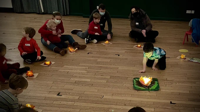 Squirrel Scouts light up their mini-campfires.