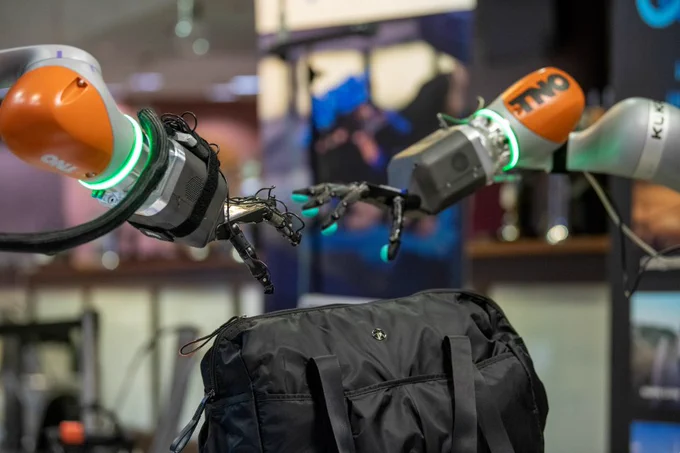 Robotic hands deal with 'suspect package' in demo.