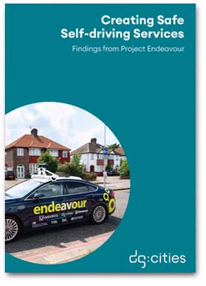 Cover of DG Cities's report Creating Safe Self-driving Services, Findings from Project Endeavour showing the logo and photo of a branded car from the Endeavour AV fleet on a suburban road in Greenwich, London