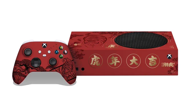 Image shows a red Xbox Series S. Chinese characters are painted on front in gold, and a tiger in style is painted on the top, along with flowers. A red Xbox Series controller sits in front of it with a tiger and nature scene painted on in black ink.