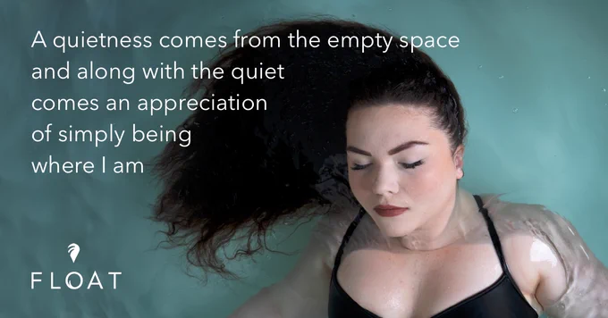 A woman floats with her dark hair swirling around her, with quote: "A quietness comes from the empty space, and along with the quiet comes an appreciation of simply being where I am."