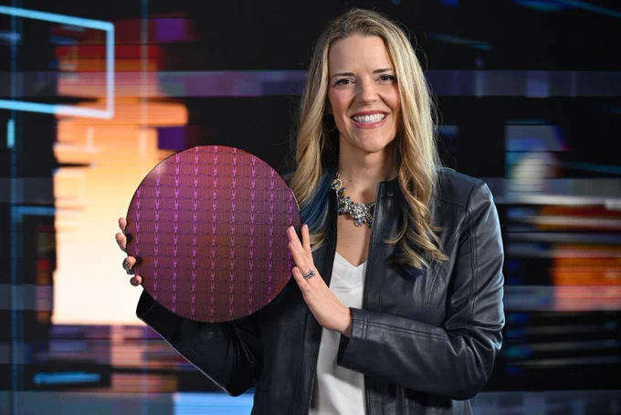 Woman holding a silicon wafer